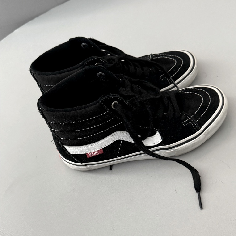 Black suede high top vans